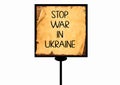 Stop War in Ukraine. Motivational quote on torn paper isolated on white background Royalty Free Stock Photo