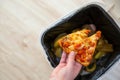 Stop wasting food, Woman hand throwing some food, pizza pieces to the bin, trash, food concept Royalty Free Stock Photo