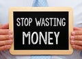 Stop wasting Money - Manager with chalkboard Royalty Free Stock Photo