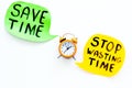 Stop wasting time, save time hand letterng near alarm clock on white background top view copy space. Business concept Royalty Free Stock Photo