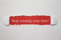 Stop wasting your time word on a torn paper. Royalty Free Stock Photo