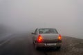 Stopped car in the fog Royalty Free Stock Photo