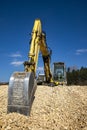 stopped Yellow excavator at the construction site.