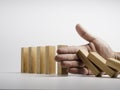 Stopping the domino effect. Business crisis management. Royalty Free Stock Photo