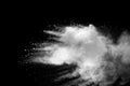 Explosion of white dust on black background.