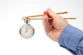 Stopwatch on bamboo chopsticks. speed concept for cooking and eating food