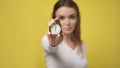 Stopwatch in foreground in hand of attractive young woman. stopwatch counts down from zero. Retro old vintage clock Royalty Free Stock Photo