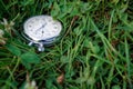 Stopwatch lies on green grass, sportive concept Royalty Free Stock Photo