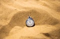 Stopwatch lying on the sand, beach volleyball competitions. Timeout and running time Royalty Free Stock Photo