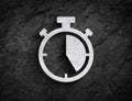 Stopwatch symbol stone wall background