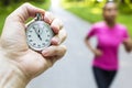 Stopwatch Timer and Young Woman Running Royalty Free Stock Photo