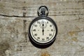 Stopwatch on wooden background, close up