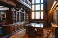 Storage of books. Large old library in the Gothic style. Shelves and rows with books. City Library at the City Hall of Denmark