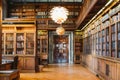 Storage of books. Large old library in the Gothic style. Shelves and rows with books. City Library at the City Hall of Denmark