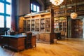 Storage of books. Large old library in the Gothic style. Shelves and rows with books. City Library at the City Hall of Denmark