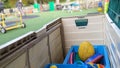 A storage box full of sports equipment for the playground