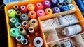 Storage box with spools of multi-colored threads, sewing needles. Storage system for sewing needlework at home Royalty Free Stock Photo