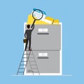 Storage box with yellow folders. Cartoon male clerk uses magnifying glass to search for documents. Files search, office paperwork Royalty Free Stock Photo