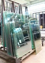 Storage of finished glass panes for sale for house construction in a glassworks Royalty Free Stock Photo