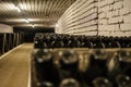 hall of white sparkling wine bottles in the winery cellar Royalty Free Stock Photo