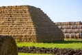 Storage of hay and straw in bales and rolls on the farm. Concept theme: Stock raising. Food security. Agricultural. Farming. Food Royalty Free Stock Photo