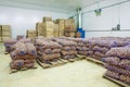 Storage house potato in bags and crates Royalty Free Stock Photo