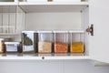 Storage ideas in the kitchen. White box and basket. Shelf order system. Royalty Free Stock Photo