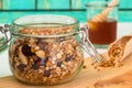 Storage jar with granola grain shovel and honey dipper Royalty Free Stock Photo