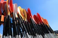 Storage rack with paddles for kayaks against blue sky