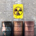 Storage radioactive waste, barrels resting on a wall, sign with radioactivity symbol, nuclear material Royalty Free Stock Photo