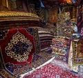 In a storage room of a carpet merchant