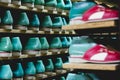 Storage room with slippers shoes on shelves in family run firm