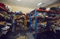 Storage shelves full of fabric and leather rolls at clothing or shoe making factory Royalty Free Stock Photo