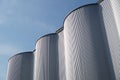 Storage silos against blue sky for beer processing Royalty Free Stock Photo