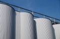 Storage silos against blue sky for beer processing Royalty Free Stock Photo