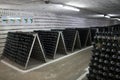 The storage of sparkling wine in a wine cellar. Royalty Free Stock Photo