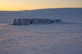 Storage of straw bales in a field in winter