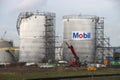 Storage tank with Mobil logo on the refinery of Exxon Mobile at Pernis in the port