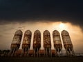 Storage tanks with dramatic sky