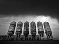 Storage tanks with dramatic sky