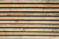 Storage timber. Lumber yard. Stock of timber wood construction in warehouse.Planks of wood stacked neatly on the shelves in the ha Royalty Free Stock Photo