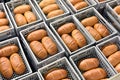 Storage and transport of freshly baked loaves of bread in a bakery for sale - industrial food production