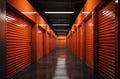 Storage units rent. Man in warehouse hallway. Guy carries boxes into storage units. Doors to warehouse units are closed Royalty Free Stock Photo