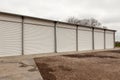 Storage units with roller shutter doors in industrial area