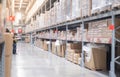 The storage warehouse of the cardboard boxes put on the stainless steel shelves, industry warehouse concept.