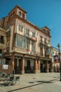 Store building in eclectic style with ceramics details at Merida