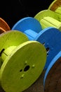 A store of cable drums painted in different colours