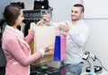 Store clerk serving purchaser