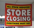 Store closing down sign in town high street. Royalty Free Stock Photo