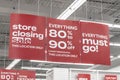 Store Closing and huge discount signs displayed at a soon to be out of business clearance sale. Everything must go.